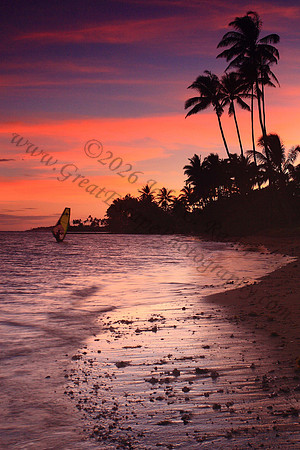 Windsurfer returning at sunset at Kawaikui Beach Oahu Hawaii