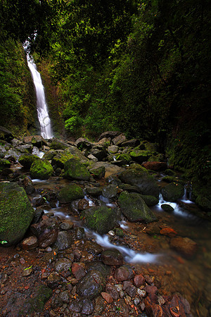 Heavy rain Lulumahu Falls tucked in the Koolau Mountains in Nuuanu Valley, Oahu, Hawaii