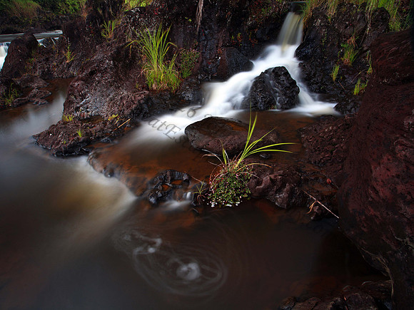 Small waterfall on Wailuku River in Hilo Hawaii Big Island