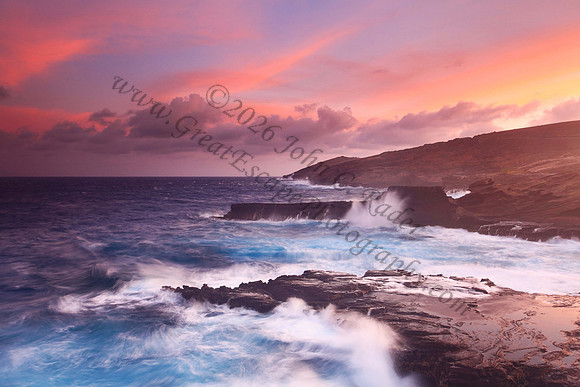 Colorful sunset and big waves crashing on Ka Iwi Coastline Oahu Hawaii