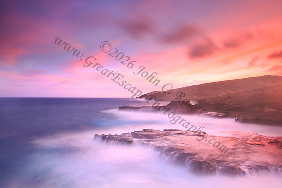 Colorful sunset and big waves crashing on Ka Iwi Coastline Oahu Hawaii