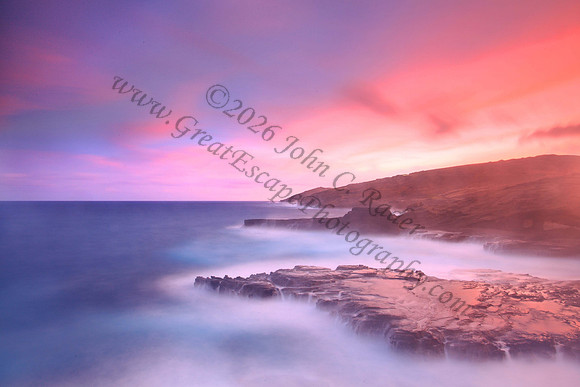 Colorful sunset and big waves crashing on Ka Iwi Coastline Oahu Hawaii