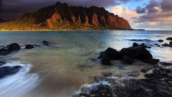 Sunrise over Kualoa as seen from Mokolii or Chinaman's Hat, Koolau Mountains Oahu Hawaii