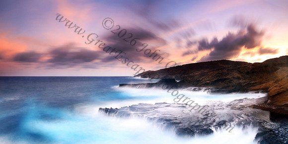 Colorful sunset and big waves crashing on Ka Iwi Coastline Oahu Hawaii