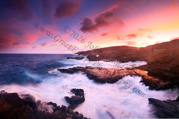 Colorful sunset and big waves crashing on Ka Iwi Coastline Oahu Hawaii