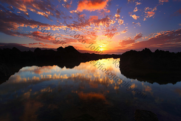 Sunset as seen from Keiki Beach, found on North Shore of Oahu Hawaii