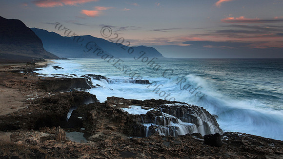 Large surf waves attack Waianae Coast leeward side of Yokohama Bay Oahu Hawaii