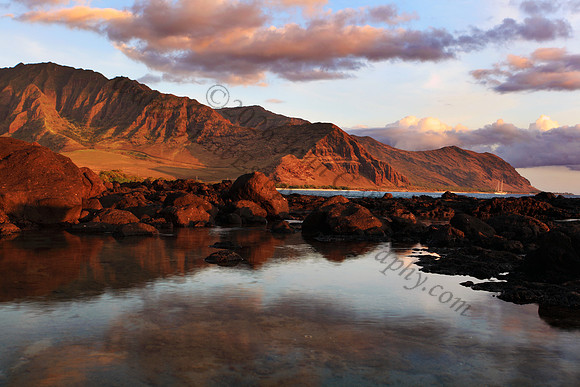 Sunset over Waianae Coast Makua Valley sailboat Oahu Hawaii leeward