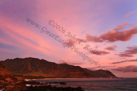Sunset over Waianae Coast Makua Valley sailboat Oahu Hawaii leeward