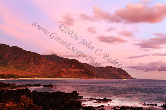 Sunset over Waianae Coast Makua Valley sailboat Oahu Hawaii leeward