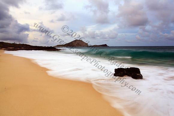 Sunset and waves over Manana and Kaohikaipu Islands, or Rabbit and Flat Islands, near Makapuu Oahu Hawaii