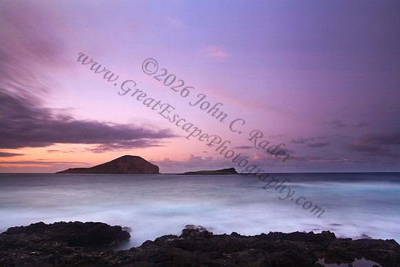 Sunset and waves over Manana and Kaohikaipu Islands, or Rabbit and Flat Islands, near Makapuu Oahu Hawaii
