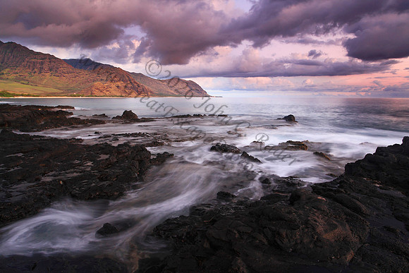 Sunset looking into Makua Bay during large waves, Oahu Hawaii