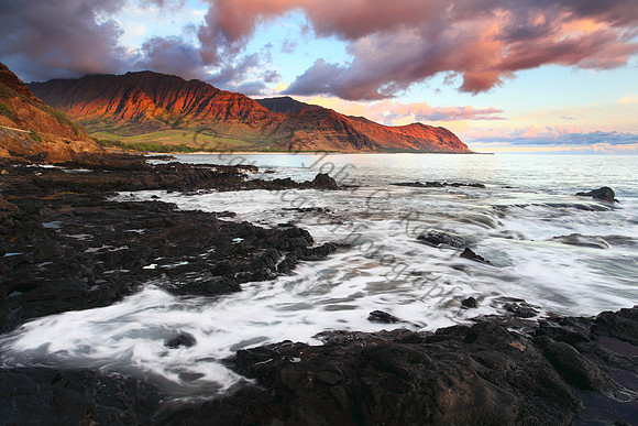 Sunset looking into Makua Bay during large waves, Oahu Hawaii