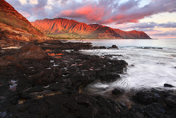 Sunset looking into Makua Bay during large waves, Oahu Hawaii