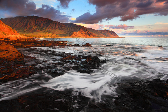 Sunset looking into Makua Bay during large waves, Oahu Hawaii