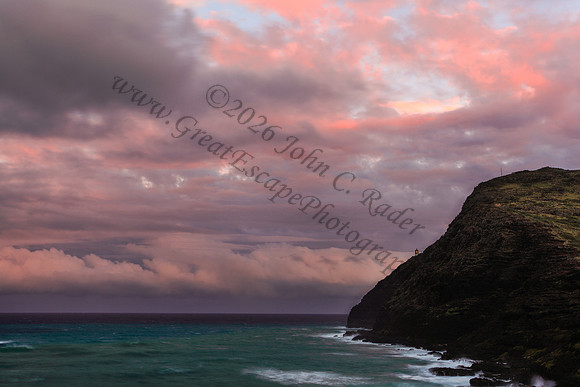 Sunset at Makapuu beach and lighthouse overlooking Rabbit Island on Oahu Hawaii