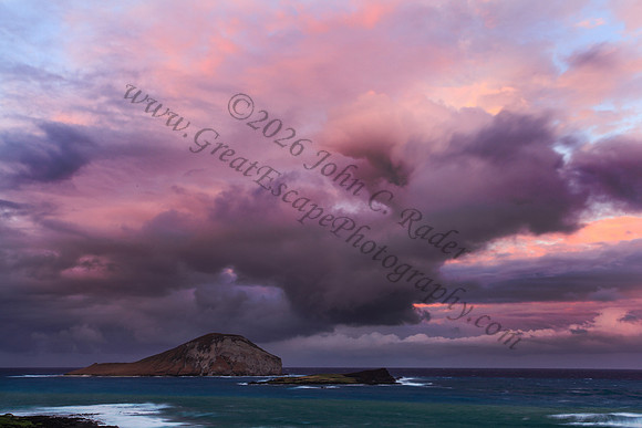 Sunset at Makapuu beach and lighthouse overlooking Rabbit Island on Oahu Hawaii