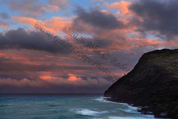 Sunset at Makapuu beach and lighthouse overlooking Rabbit Island on Oahu Hawaii