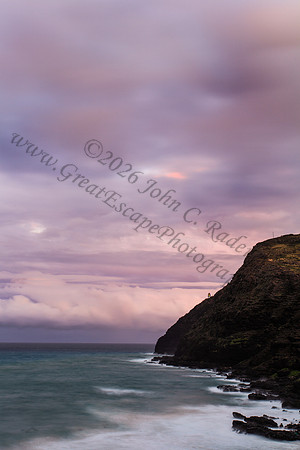 Sunset at Makapuu beach and lighthouse overlooking Rabbit Island on Oahu Hawaii