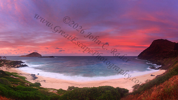 Sunset and waves wash Makapuu Beach lighthouse Oahu Hawaii