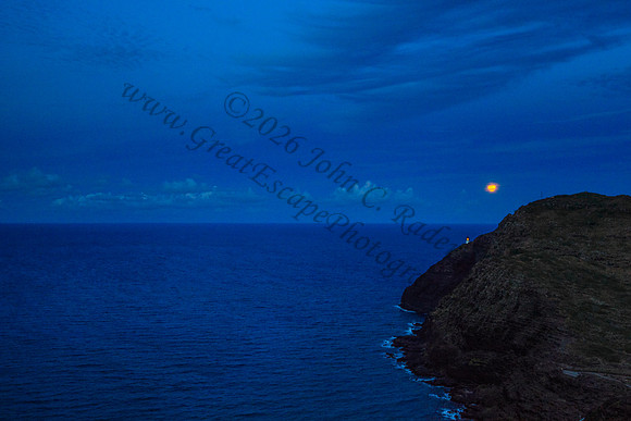 Supermoon rising over makapuu lighthouse and beach, Oahu, Hawaii