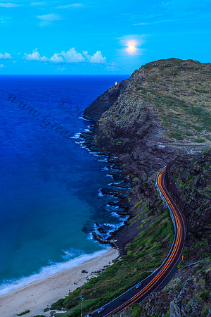 Supermoon rising over makapuu lighthouse and beach, Oahu, Hawaii