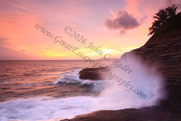 Waves crash on cliffs spitting caves explosions sunset splashing Oahu Hawaii
