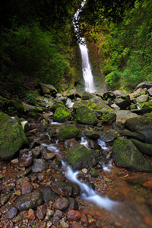 Heavy rain Lulumahu Falls tucked in the Koolau Mountains in Nuuanu Valley, Oahu, Hawaii